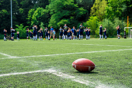 American football on field with team in backgroundの写真素材