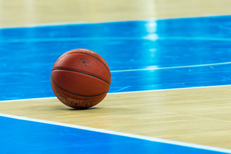 orange basketball ball on the wooden court
