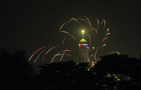 Beautiful fireworks in the sky behind mosque minaret.this photo was taken from...