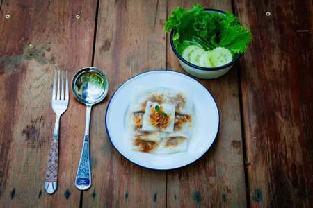 steamed rice skin dumplings, thai style dessert on woodenの写真素材