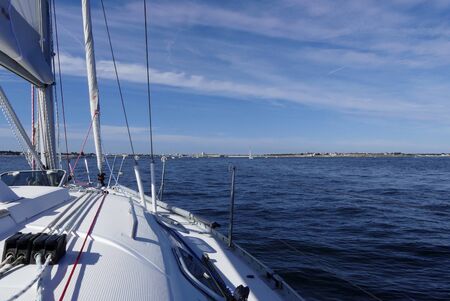 Details of sailing boat deck with coastal landscape backgroundの写真素材