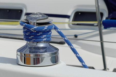 Winch with blue rope on sailing boat