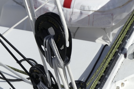 close up of pulleys on modern sailing boat racer.の写真素材