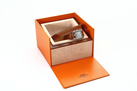 Lorient, France - March 17, 2017: Hermes Paris, famous steel watch for women "Cape cod", silvered opaline dial, long double interchangeable round Barenia natural calfskin strapのeditorial素材