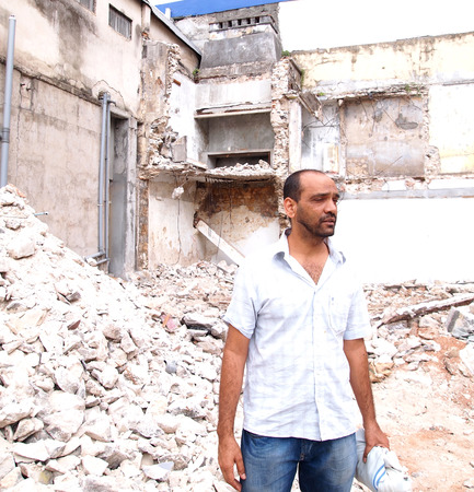 Syrian man in front of rubbleのeditorial素材