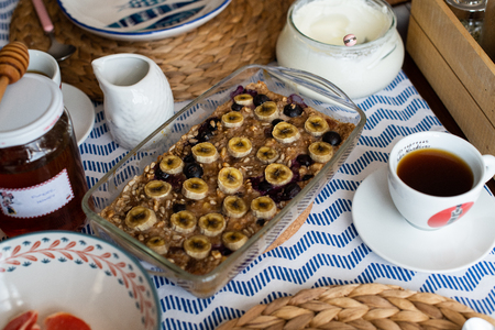 baked oatmeal with banana, blueberries, walnut and raisins.の写真素材