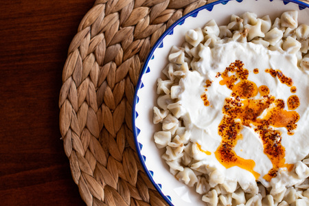 Traditional Turkish Food, Manti AKA Turkish Ravioli served with yogurt and hot butter sauceの写真素材