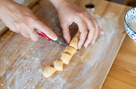 chef at work. making of paleo pumpkin gnocchi. woman hands preparing the food.