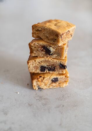 Blondie brownies with peanut butter and white chocolate. Homemade, delicious dessert.の写真素材