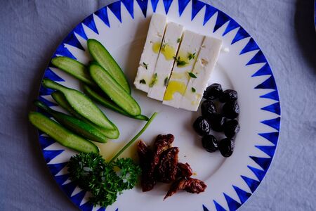 Traditional Turkish Breakfast with Sunny Side Up Eggs, Feta Cheese, Tea, Olives and Cucumber. Breakfast for twoの写真素材