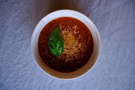 Homemade tomato soup with parmesan cheeseの写真素材
