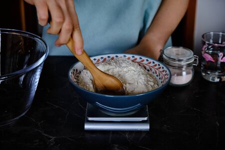 Preparing homemade italian pizza, making the pizza doughの写真素材