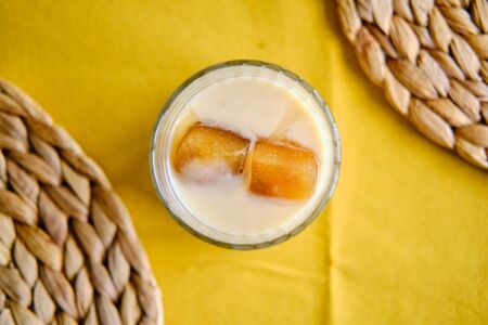 Ice cubes made with coffee in glass, preparing refreshing coffee drinkの写真素材
