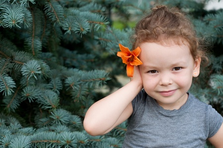 Cute little girl on the park in summer dayの写真素材
