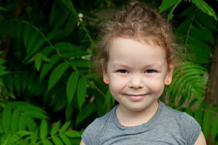 Portrait of a cute little girl outsideの写真素材