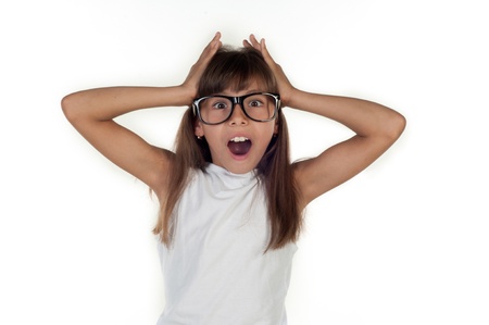 Portrait of a funny surprised girl in glasses  looking at cameraの写真素材