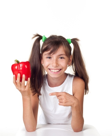 little girl with color pepper, isolated on whiteの写真素材