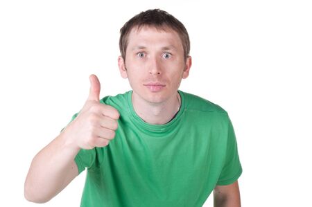 Fun man giving thumbs up sign on white backgroundの写真素材