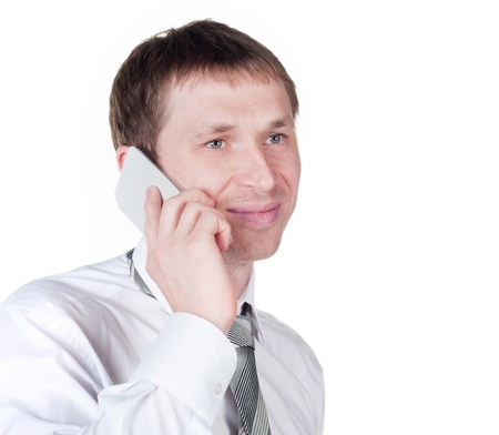 happy successful young business man talking on mobile phone on white backgroundの写真素材