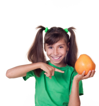 little girl with grapefruit on white backgroundの写真素材