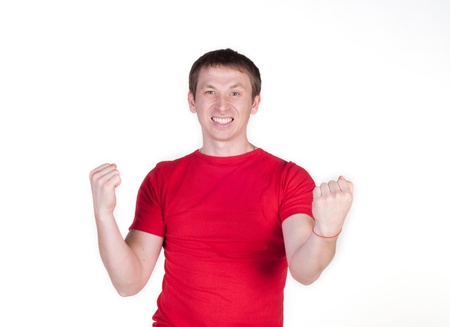 Happy young man celebrating success isolated on whiteの写真素材
