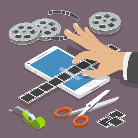 Mobile video editor flat vector isometric concept. Man's hand scotch-tapes a film tape on the smartphone surrounded by some equipment.のイラスト素材