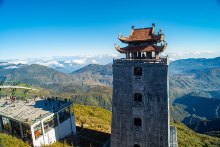 The grand bell tower of Thanh Van Dac Lo Spiritual Landmarks, with scenic misty mountain view as background, at Fansipan peak,Vietnamのeditorial素材