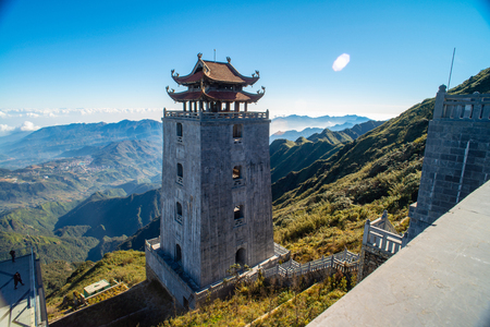 The grand bell tower of Thanh Van Dac Lo Spiritual Landmarks, with scenic misty mountain view as background, at Fansipan peak,Vietnamのeditorial素材