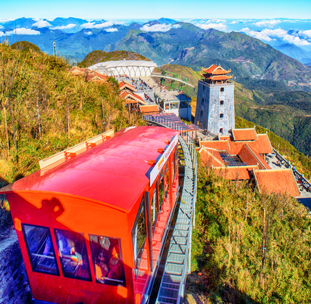 The grand bell tower of Thanh Van Dac Lo Spiritual Landmarks, with scenic misty mountain view as background, at Fansipan peak,Vietnamのeditorial素材