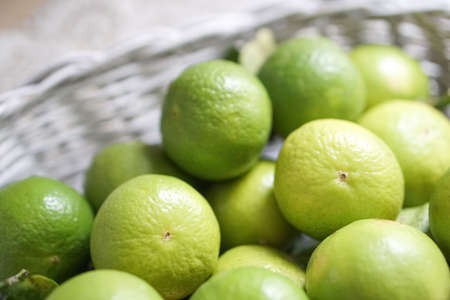 Close Up Lime in White Basketの写真素材