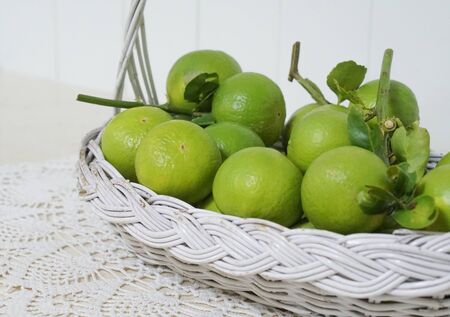 Close Up Lime in White Basketの写真素材