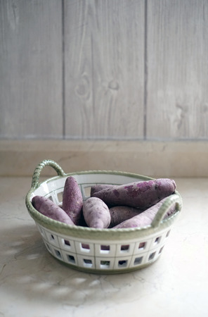 purple sweet potato in a basketの写真素材