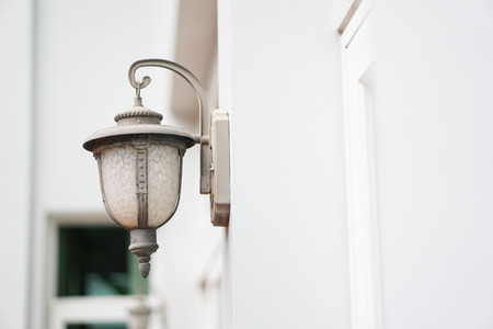 old outdoor wall lamp light on white exteriorの写真素材