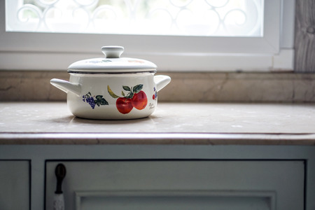 Vintage cooking pot on the kitchen tableの写真素材
