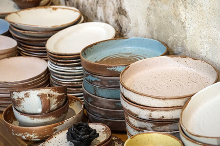 handmade color ceramic porcelain dinnerware plates dishes cups chopsticks setの写真素材