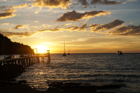 island beach sunset pier thailand people couple silhouetteの写真素材