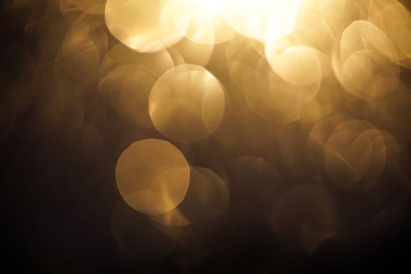 yellow light bokeh dark backgroundの写真素材