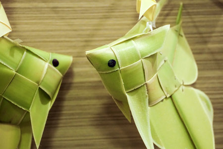 thai style palm leaf carp fish mobile handicraftの写真素材