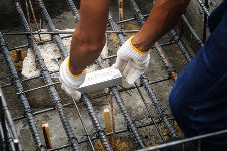 man put sacred objects bury under ground for luck in Thai Brahmin ceremonyの写真素材