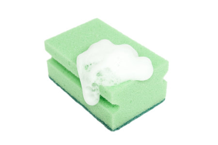 green sponge with foam isolated on white backgroundの写真素材