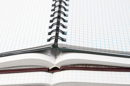 three open notebooks close up backgroundの写真素材