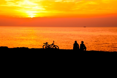 man and woman at sunset sea closeupの写真素材