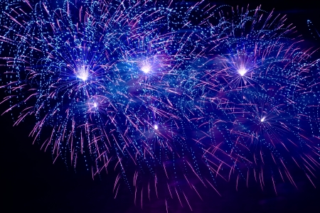 Colorful fireworks on the black sky background の写真素材