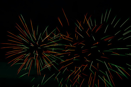 Colorful fireworks on the black sky background の写真素材