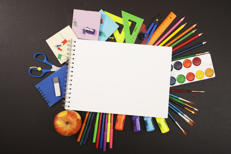 School supplies on blackboard background with copyspace for your text, design. Back to school concept for banner, promotion, webの写真素材