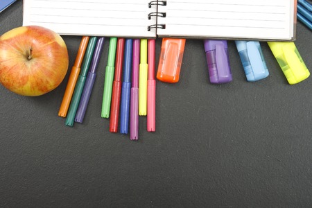 School supplies on blackboard background with copyspace for your text, design. Back to school concept for banner, promotion, web.の写真素材