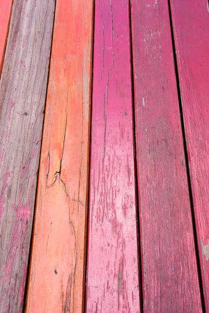 Old red grunge wood vertical panels on a rustic barnの写真素材