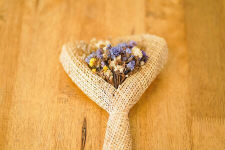 Beautiful dried flower bouquet placed on a wooden table, a bouquet of flowers for congratulations on various occasions.の写真素材