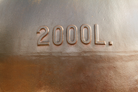 Old metal two thousand litres reservoir used for outdoor liquids storageの写真素材