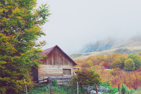 Mountains in autumn. Abandoned warehouse in a highlands. National nature park "Durmitor", Montenegro. Tinted and filtered photo.の写真素材